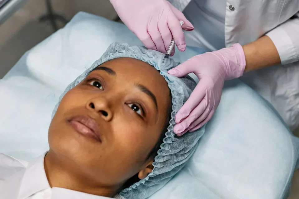 woman receiving BOTOX facial treatment